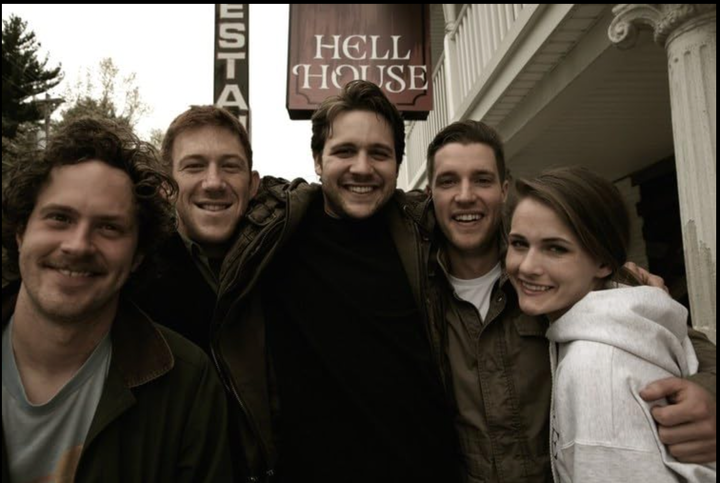 The cast of Hell House LLC, standing before the titular Hell House, about to make some truly stellar decisions.